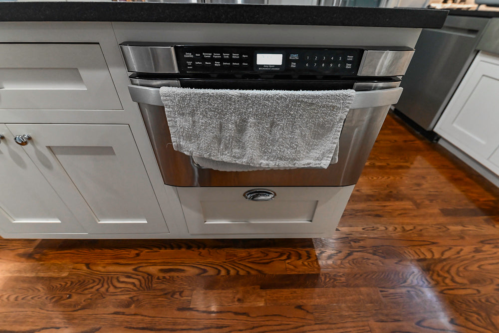 Custom Traditional White Kitchen with Stone Countertops and Appliances