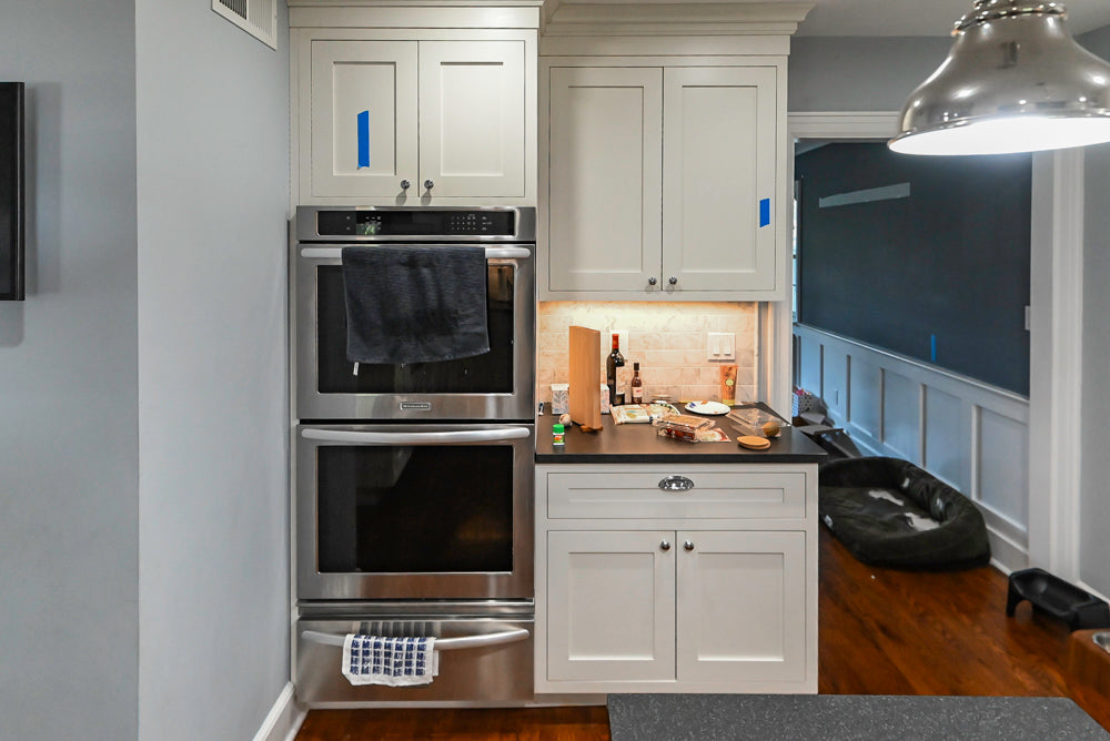 Custom Traditional White Kitchen with Stone Countertops and Appliances