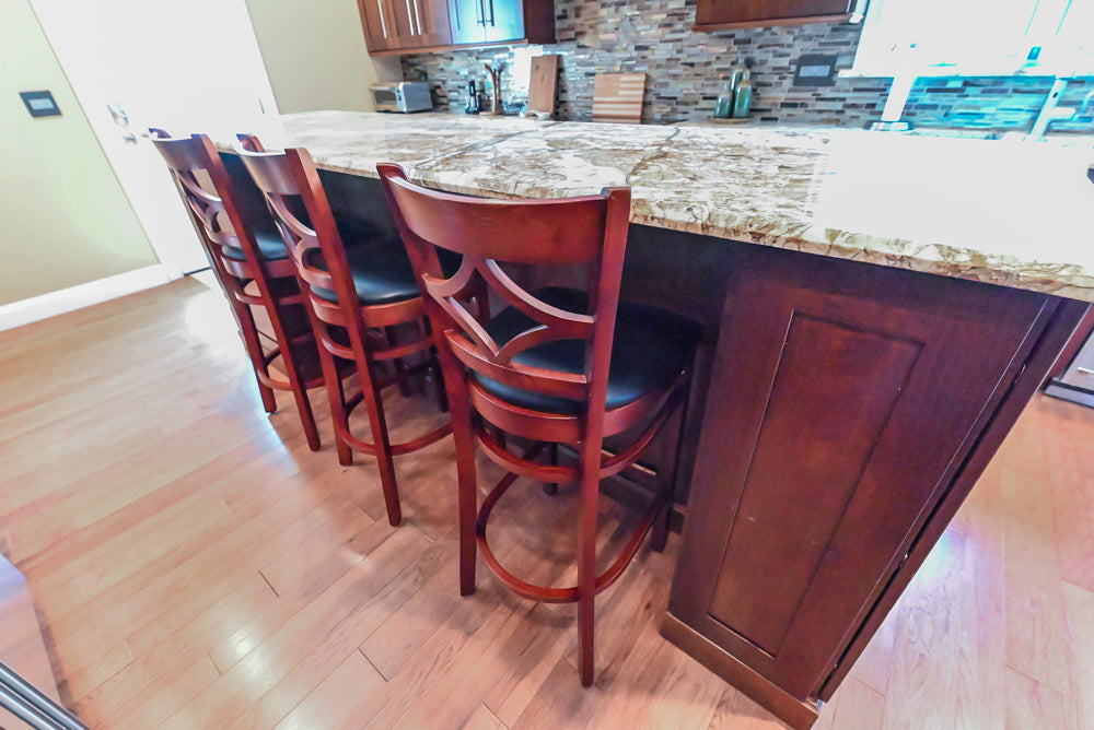 Kraftmaid Transitional Dark Wooden Kitchen with Marble Countertops and GE Monogram Appliances