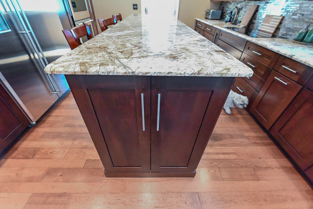 Kraftmaid Transitional Dark Wooden Kitchen with Marble Countertops and GE Monogram Appliances