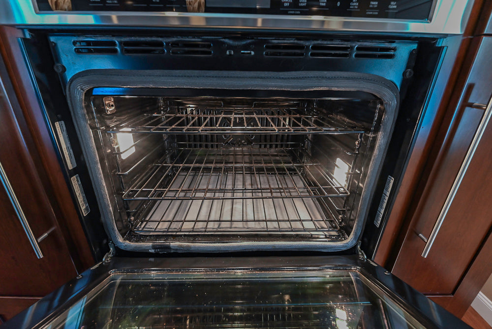 Kraftmaid Transitional Dark Wooden Kitchen with Marble Countertops and GE Monogram Appliances