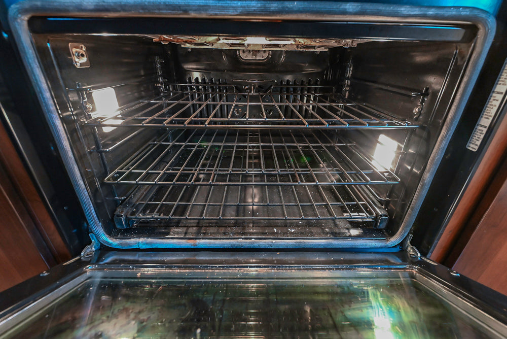 Kraftmaid Transitional Dark Wooden Kitchen with Marble Countertops and GE Monogram Appliances