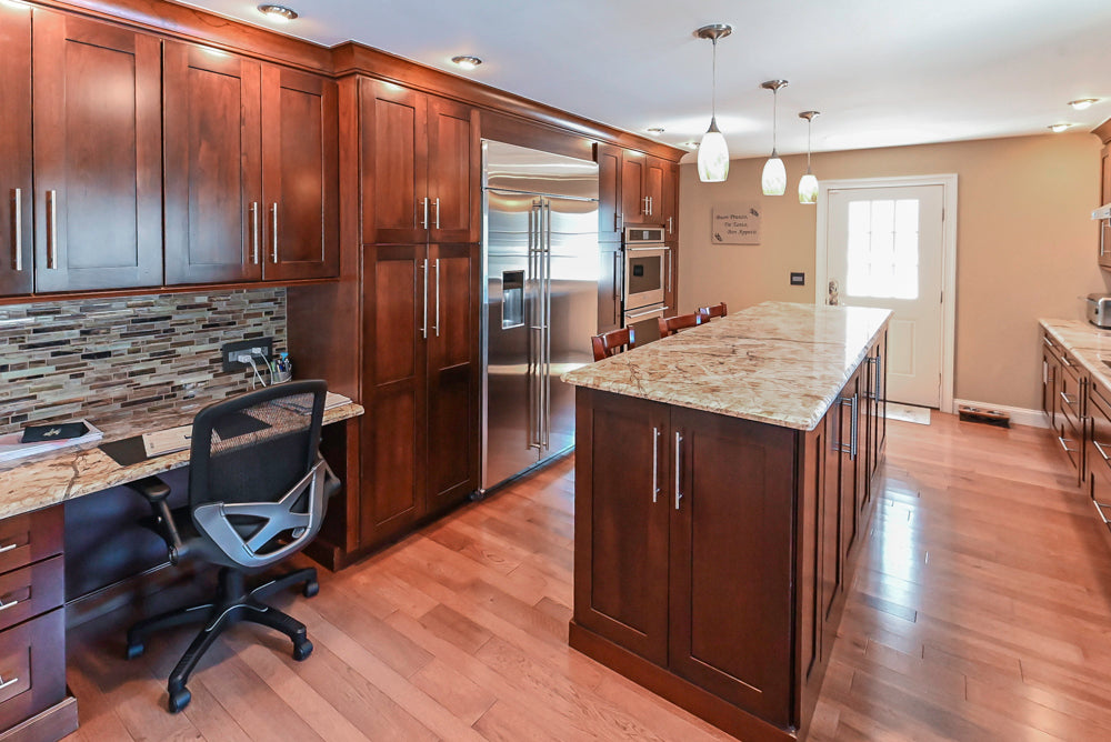 Kraftmaid Transitional Dark Wooden Kitchen with Marble Countertops and GE Monogram Appliances