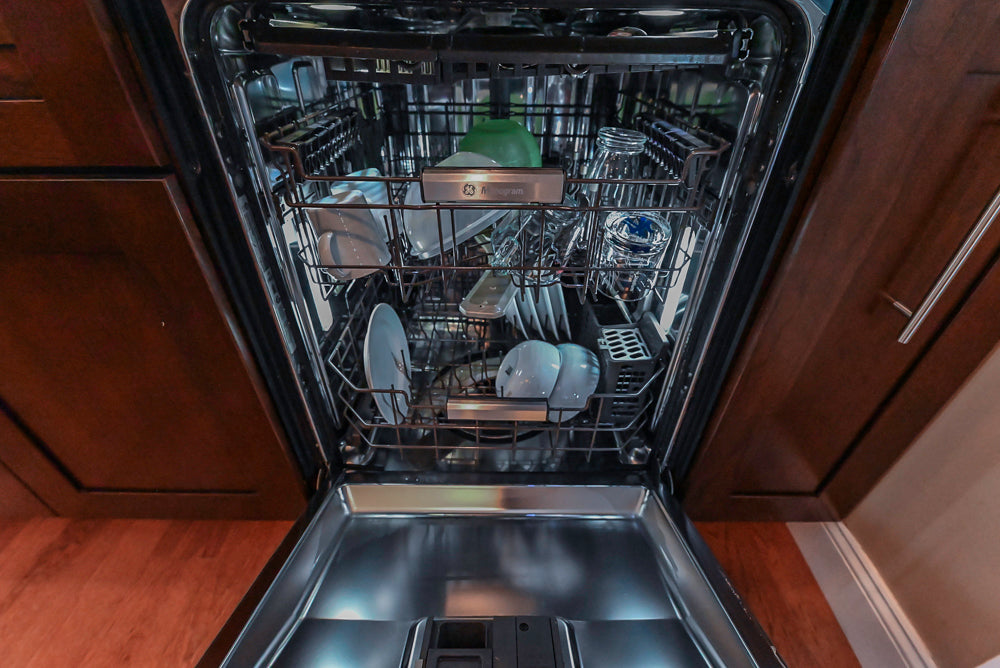 Kraftmaid Transitional Dark Wooden Kitchen with Marble Countertops and GE Monogram Appliances