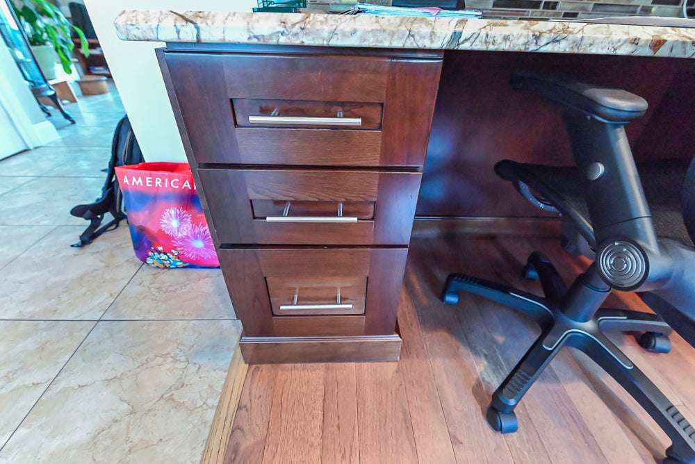 Kraftmaid Transitional Dark Wooden Kitchen with Marble Countertops and GE Monogram Appliances