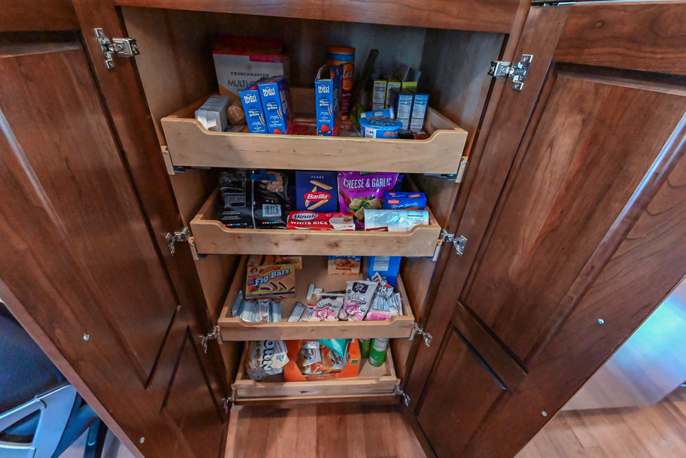 Kraftmaid Transitional Dark Wooden Kitchen with Marble Countertops and GE Monogram Appliances