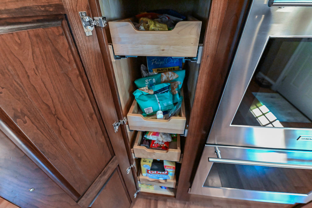 Kraftmaid Transitional Dark Wooden Kitchen with Marble Countertops and GE Monogram Appliances