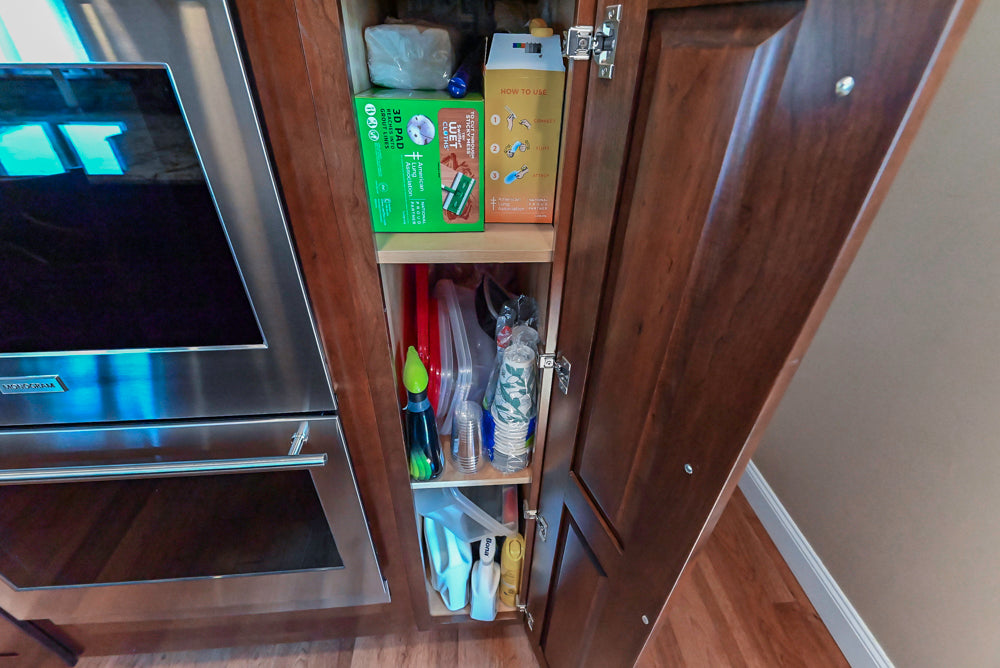 Kraftmaid Transitional Dark Wooden Kitchen with Marble Countertops and GE Monogram Appliances