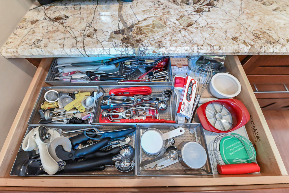 Kraftmaid Transitional Dark Wooden Kitchen with Marble Countertops and GE Monogram Appliances