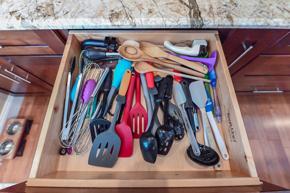 Kraftmaid Transitional Dark Wooden Kitchen with Marble Countertops and GE Monogram Appliances