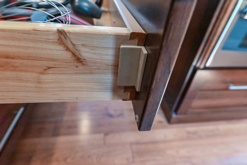 Kraftmaid Transitional Dark Wooden Kitchen with Marble Countertops and GE Monogram Appliances