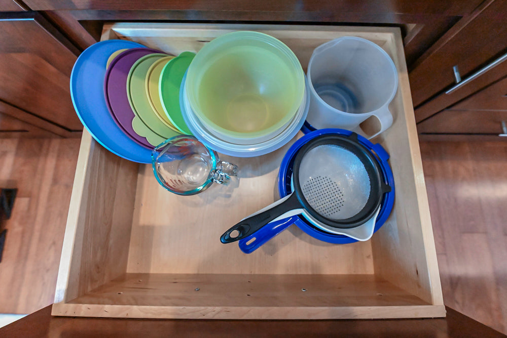 Kraftmaid Transitional Dark Wooden Kitchen with Marble Countertops and GE Monogram Appliances