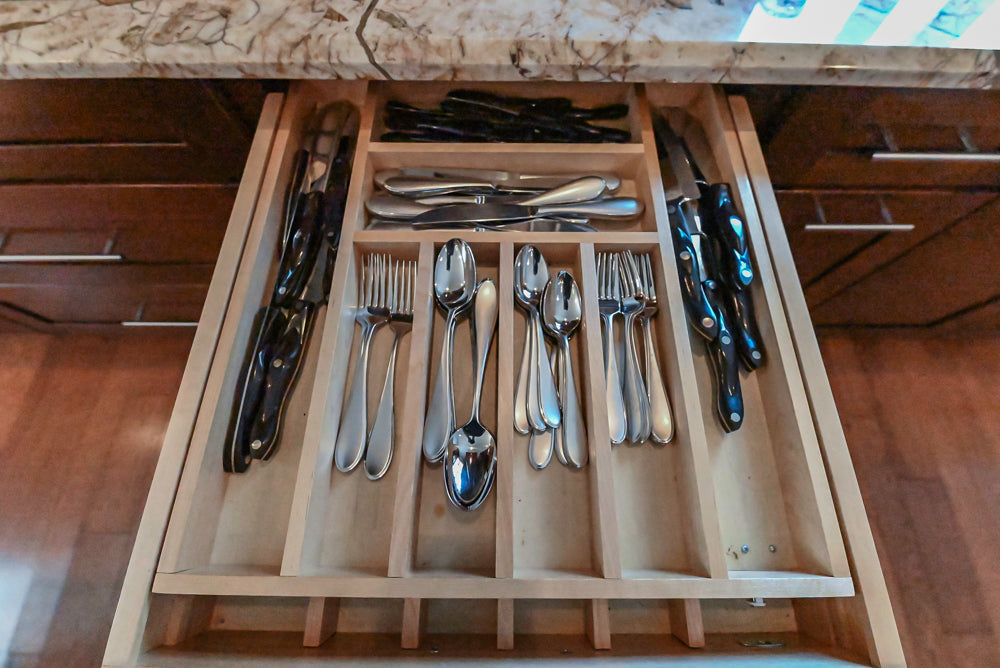 Kraftmaid Transitional Dark Wooden Kitchen with Marble Countertops and GE Monogram Appliances
