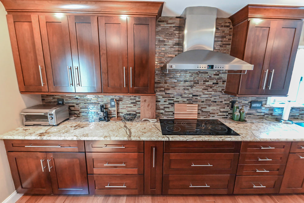 Kraftmaid Transitional Dark Wooden Kitchen with Marble Countertops and GE Monogram Appliances