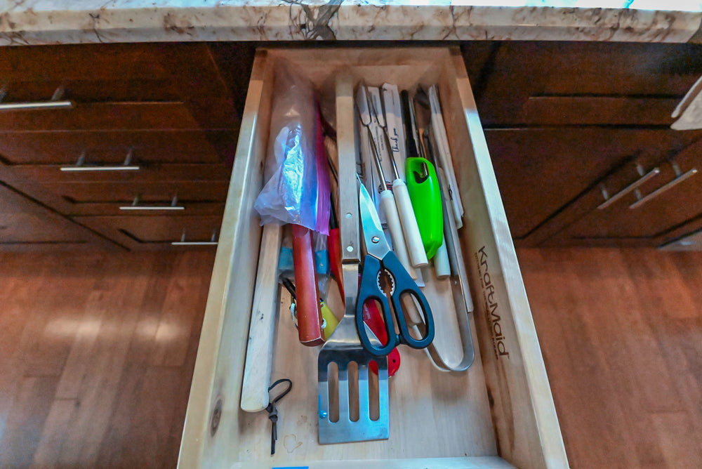 Kraftmaid Transitional Dark Wooden Kitchen with Marble Countertops and GE Monogram Appliances