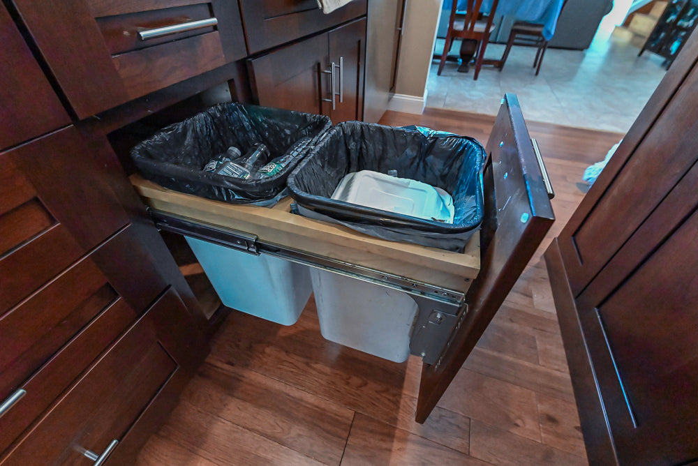 Kraftmaid Transitional Dark Wooden Kitchen with Marble Countertops and GE Monogram Appliances