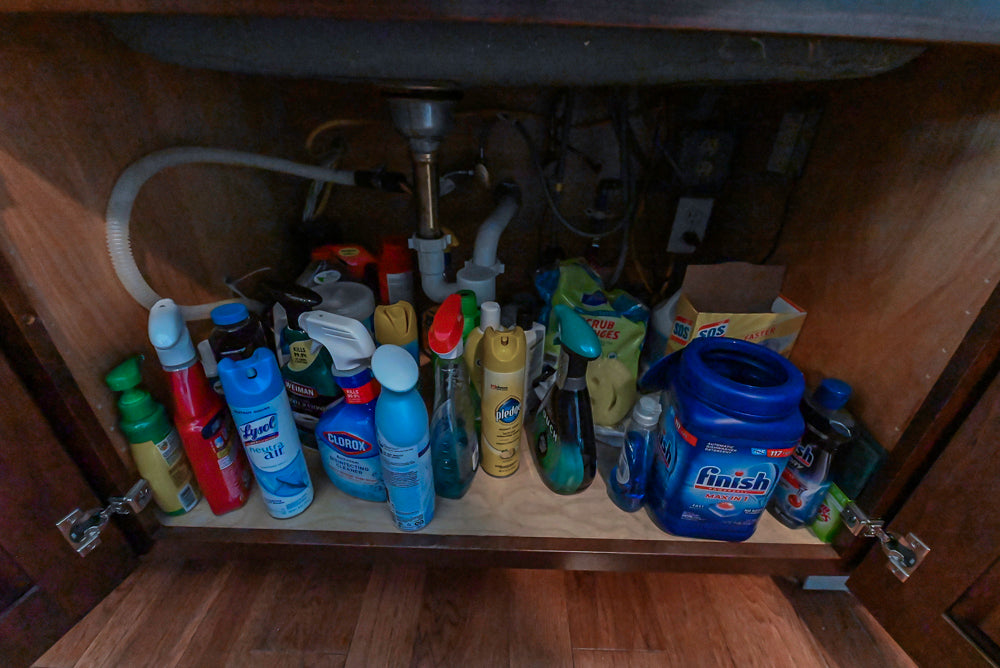 Kraftmaid Transitional Dark Wooden Kitchen with Marble Countertops and GE Monogram Appliances
