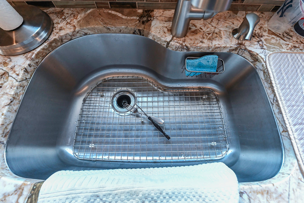 Kraftmaid Transitional Dark Wooden Kitchen with Marble Countertops and GE Monogram Appliances