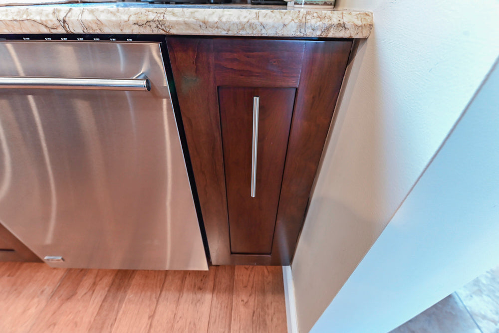Kraftmaid Transitional Dark Wooden Kitchen with Marble Countertops and GE Monogram Appliances