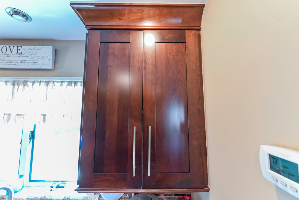 Kraftmaid Transitional Dark Wooden Kitchen with Marble Countertops and GE Monogram Appliances