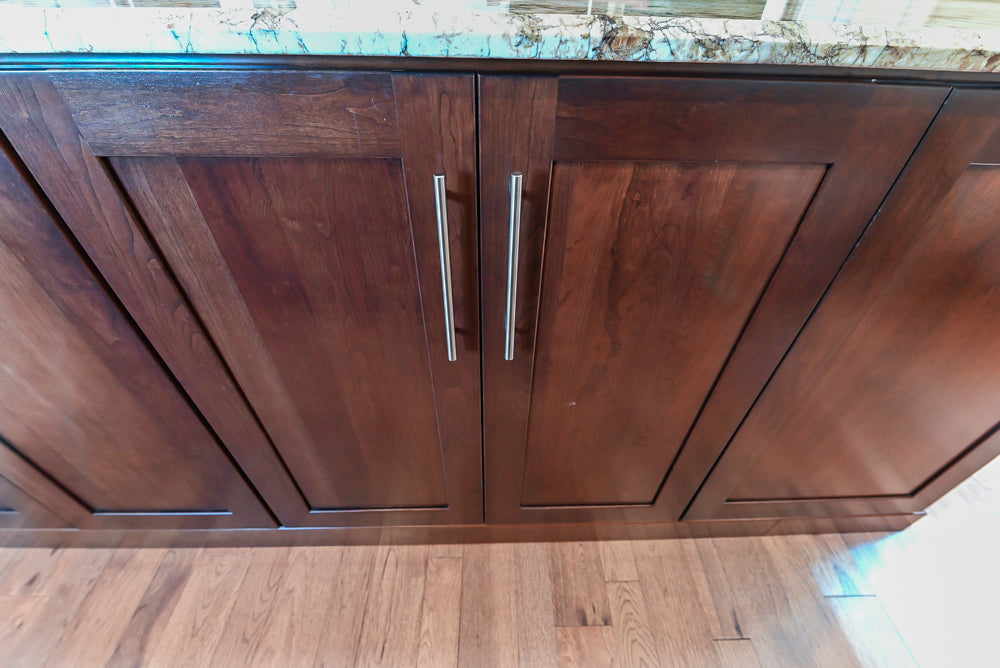 Kraftmaid Transitional Dark Wooden Kitchen with Marble Countertops and GE Monogram Appliances