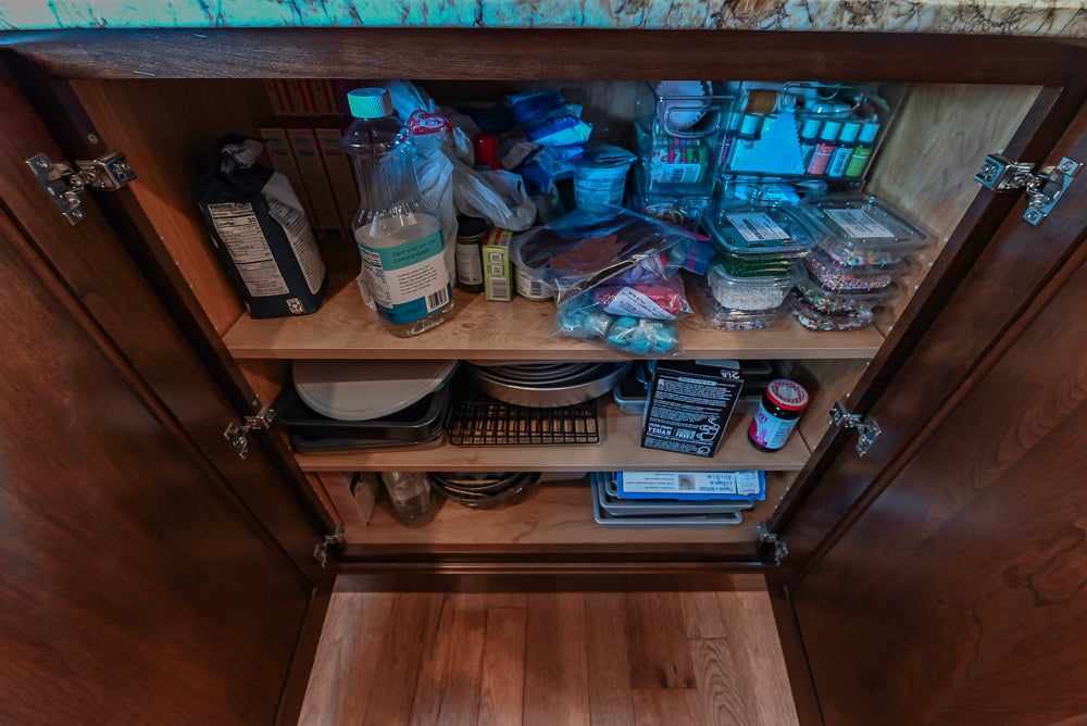 Kraftmaid Transitional Dark Wooden Kitchen with Marble Countertops and GE Monogram Appliances