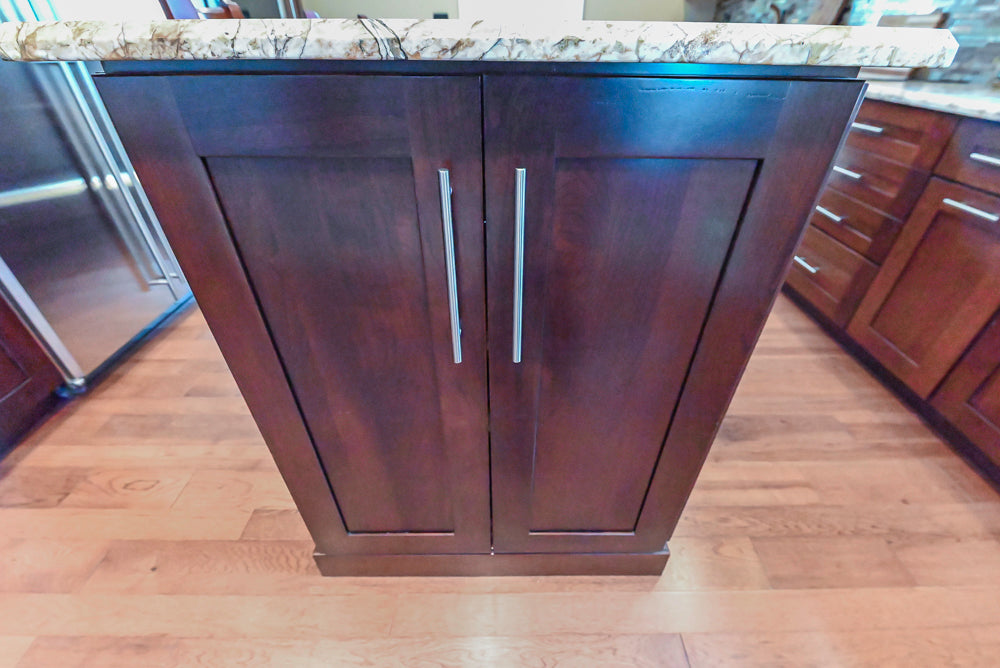 Kraftmaid Transitional Dark Wooden Kitchen with Marble Countertops and GE Monogram Appliances