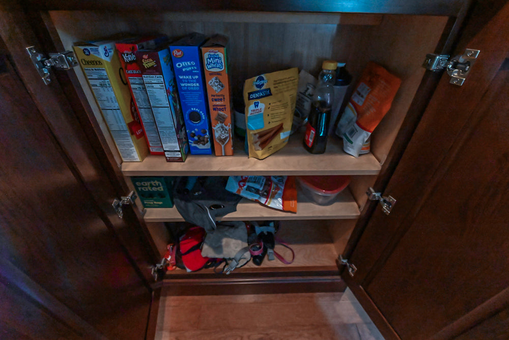 Kraftmaid Transitional Dark Wooden Kitchen with Marble Countertops and GE Monogram Appliances