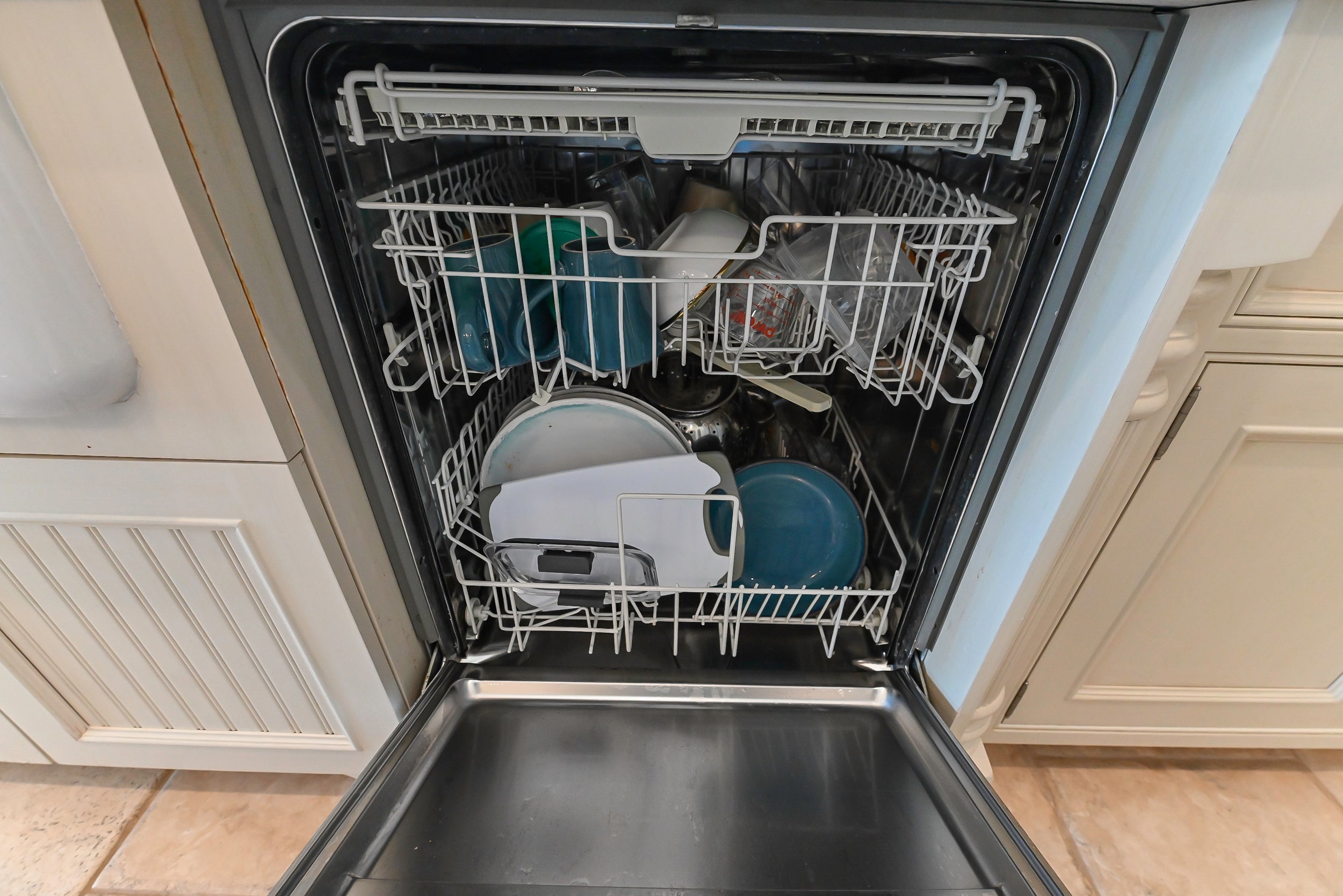 Craftmaid Traditional Off White Kitchen with Island, Granite Countertops & 48" Sub-Zero Refrigerator