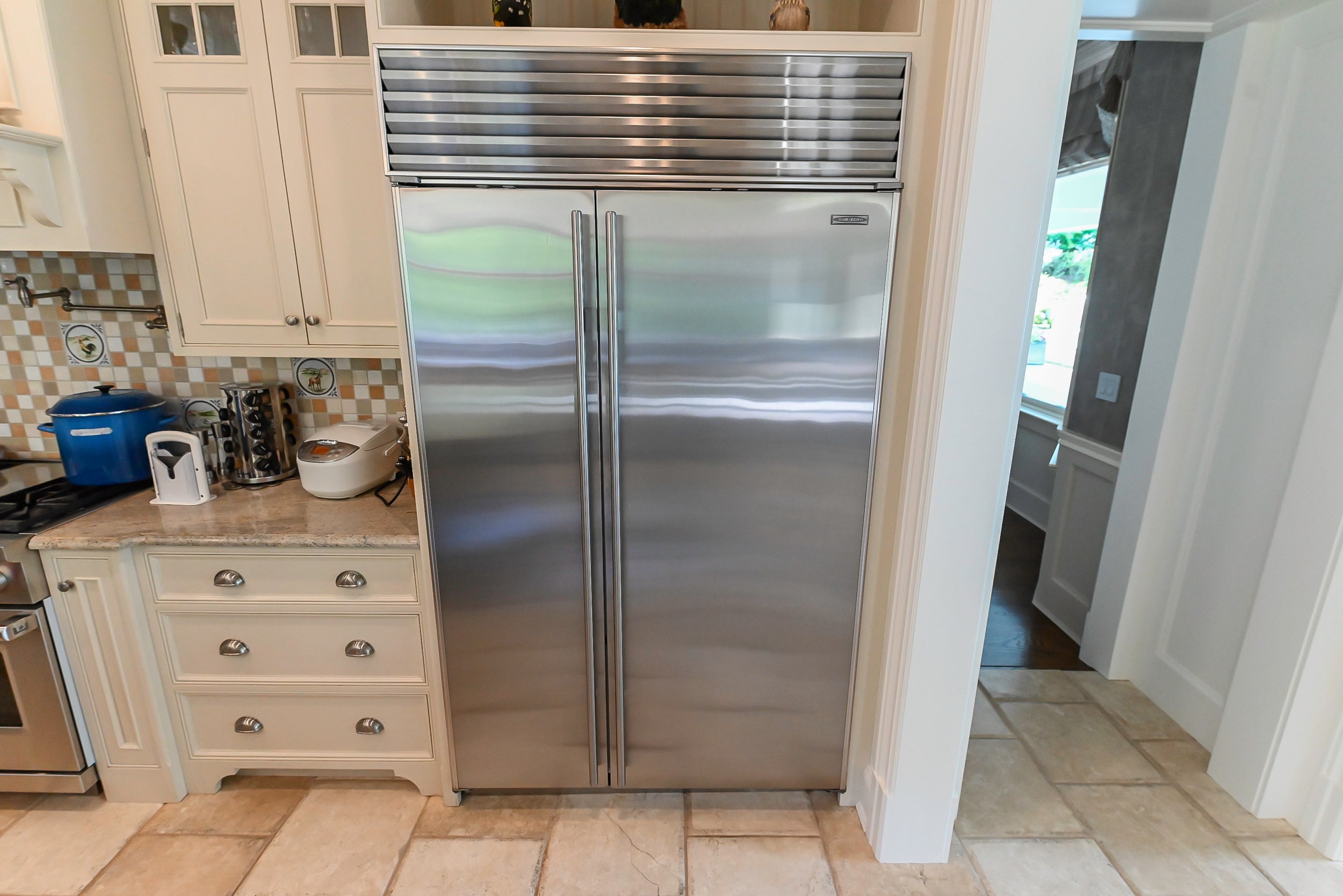 Craftmaid Traditional Off White Kitchen with Island, Granite Countertops & 48" Sub-Zero Refrigerator