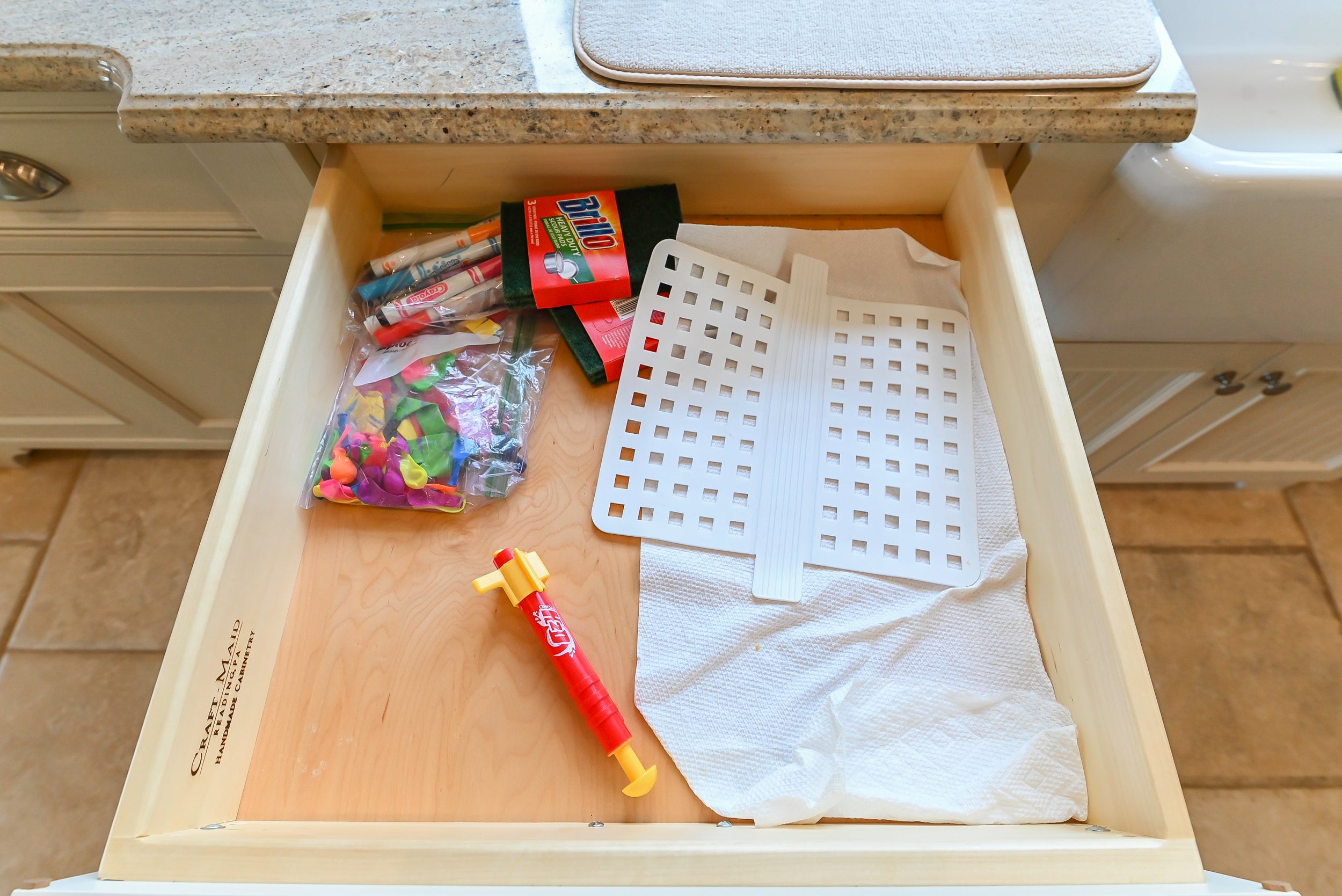 Craftmaid Traditional Off White Kitchen with Island, Granite Countertops & 48" Sub-Zero Refrigerator