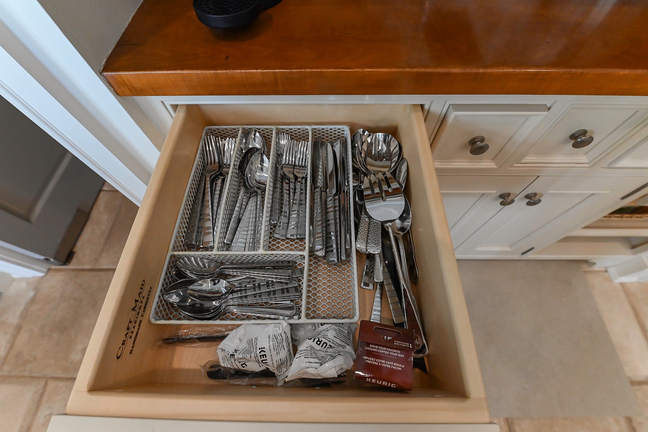 Craftmaid Traditional Off White Kitchen with Island, Granite Countertops & 48" Sub-Zero Refrigerator