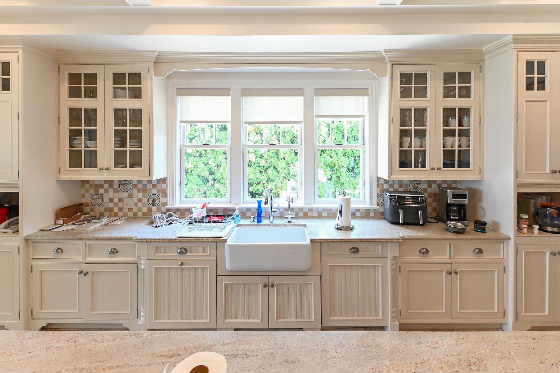 Craftmaid Traditional Off White Kitchen with Island, Granite Countertops & 48" Sub-Zero Refrigerator