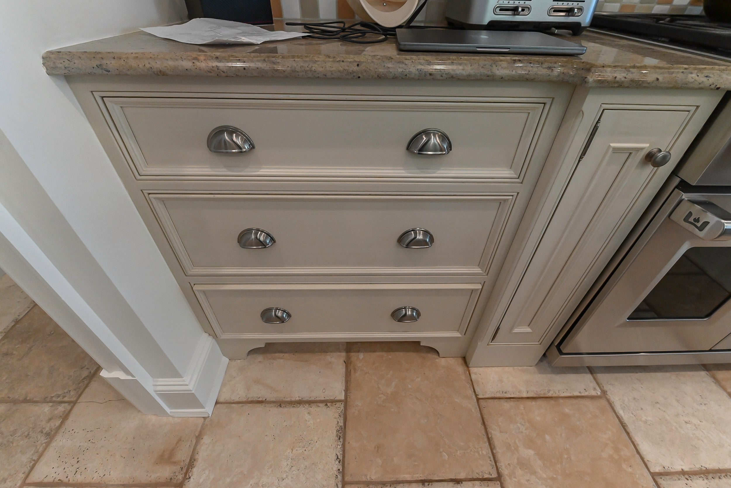 Craftmaid Traditional Off White Kitchen with Island, Granite Countertops & 48" Sub-Zero Refrigerator