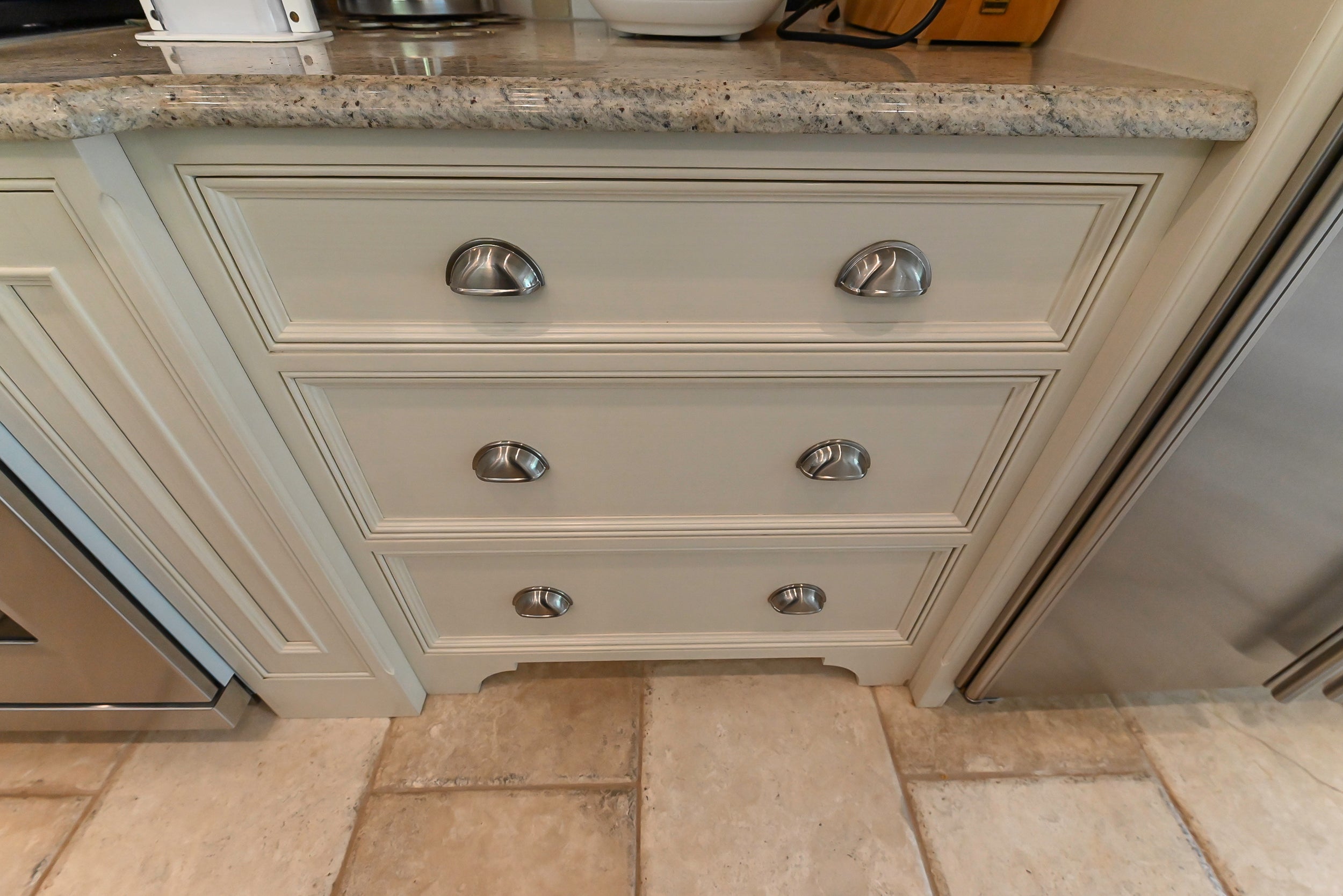 Craftmaid Traditional Off White Kitchen with Island, Granite Countertops & 48" Sub-Zero Refrigerator