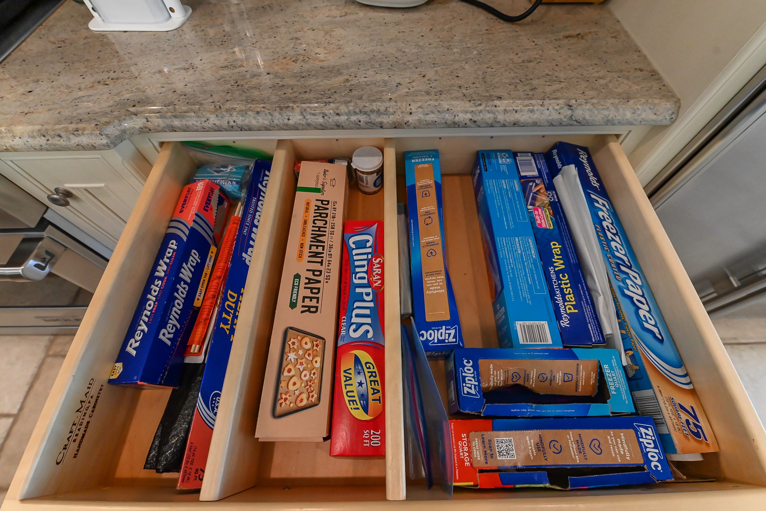 Craftmaid Traditional Off White Kitchen with Island, Granite Countertops & 48" Sub-Zero Refrigerator