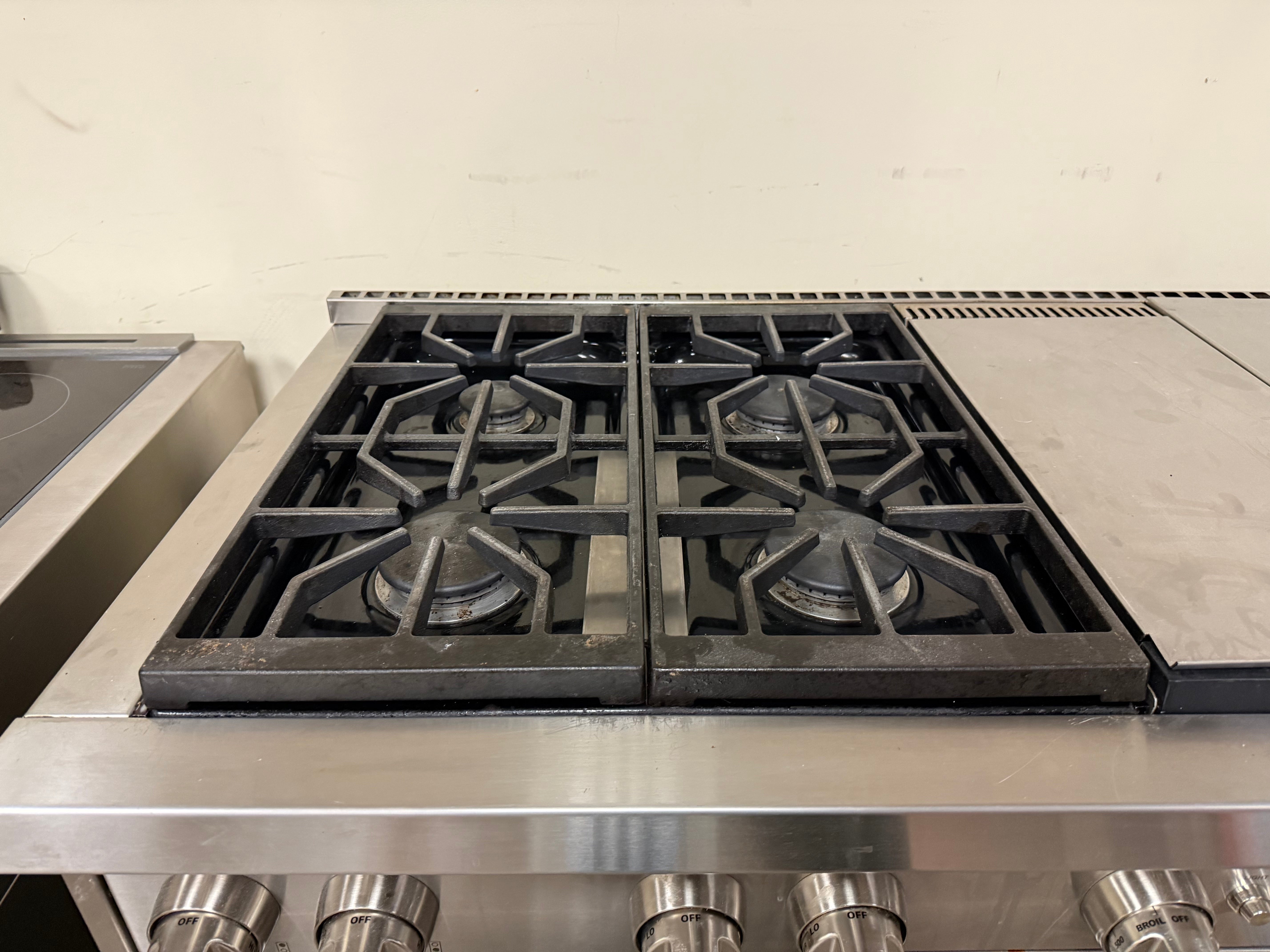 Side profile of the Wolf GR606CG showing the heavy-duty professional depth and stainless steel finish.