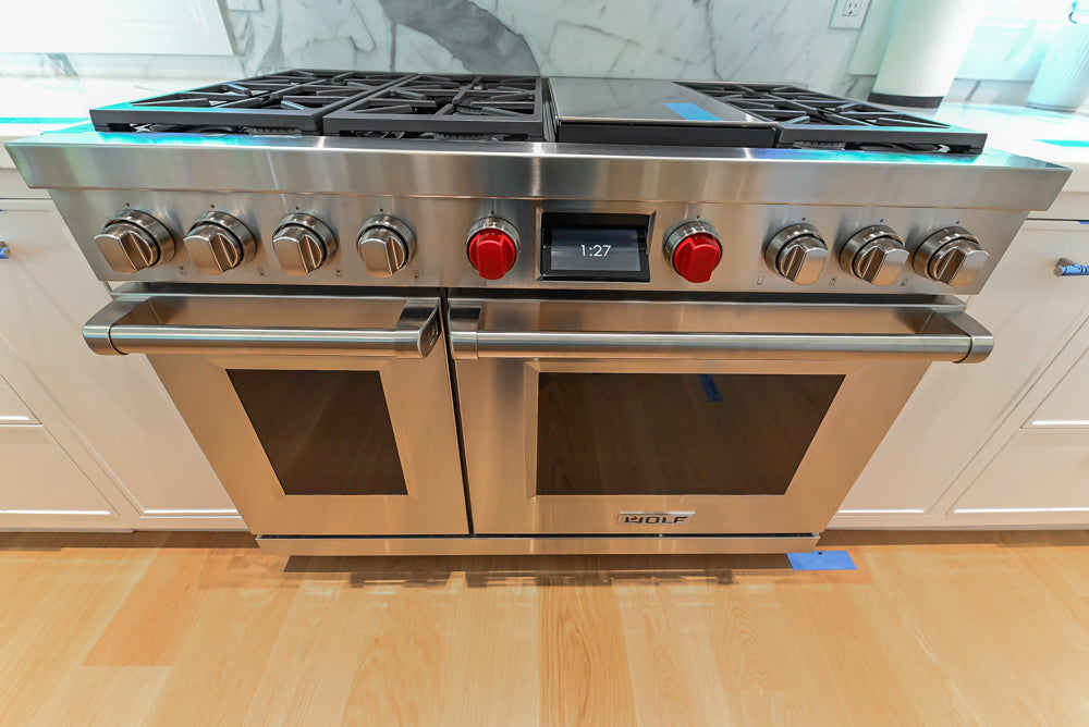 Custom Transitional White Kitchen with Natural Wood Toned Island, White Marble Countertops and 48" Wolf Range