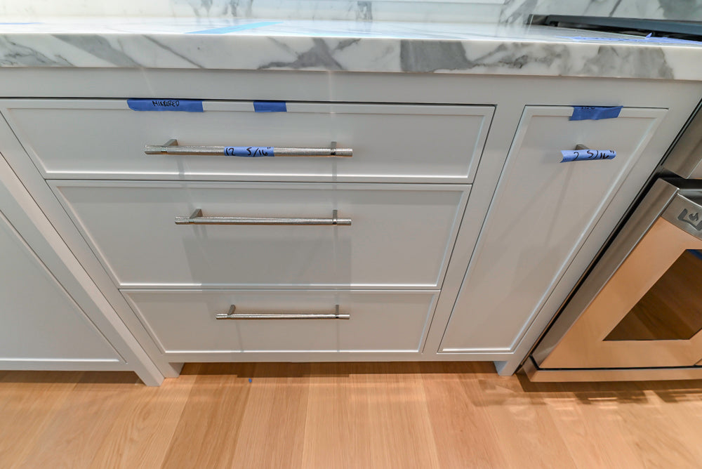 Custom Transitional White Kitchen with Natural Wood Toned Island, White Marble Countertops and 48" Wolf Range