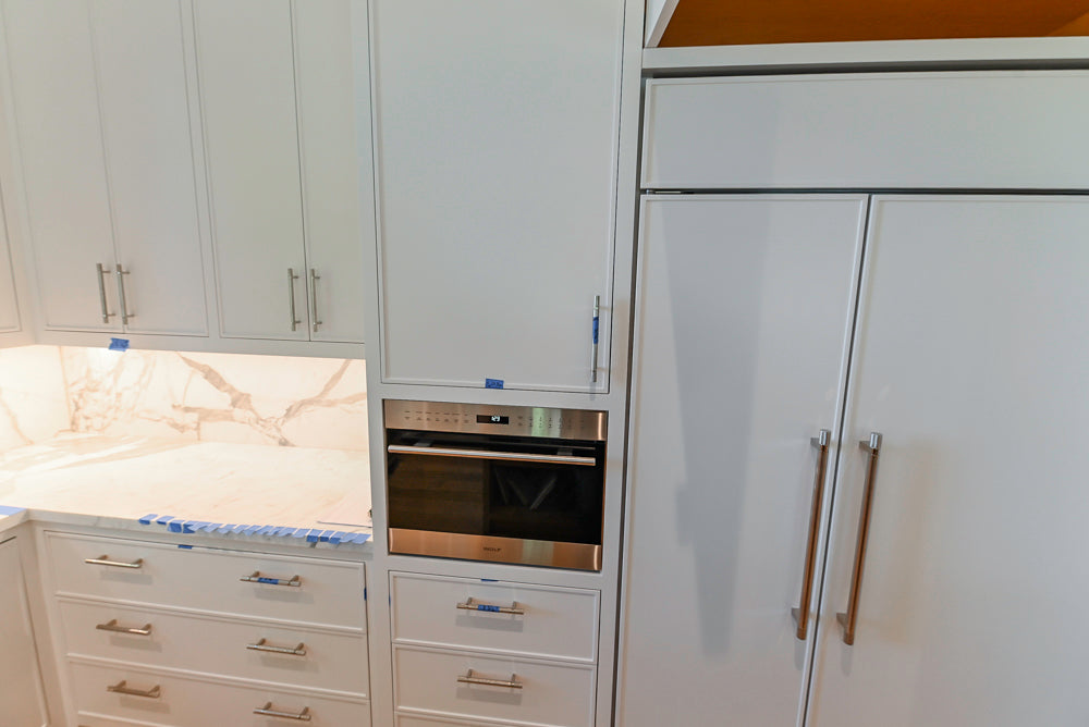 Custom Transitional White Kitchen with Natural Wood Toned Island, White Marble Countertops and 48" Wolf Range