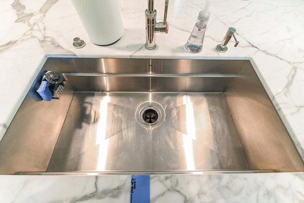 Custom Transitional White Kitchen with Natural Wood Toned Island, White Marble Countertops and 48" Wolf Range