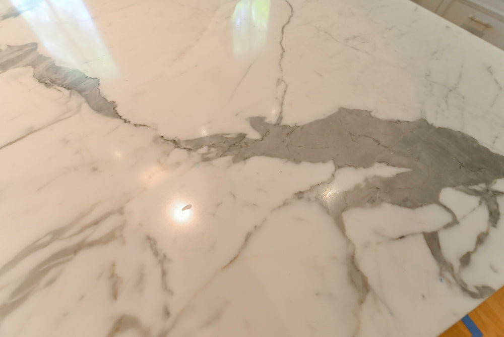 Custom Transitional White Kitchen with Natural Wood Toned Island, White Marble Countertops and 48" Wolf Range