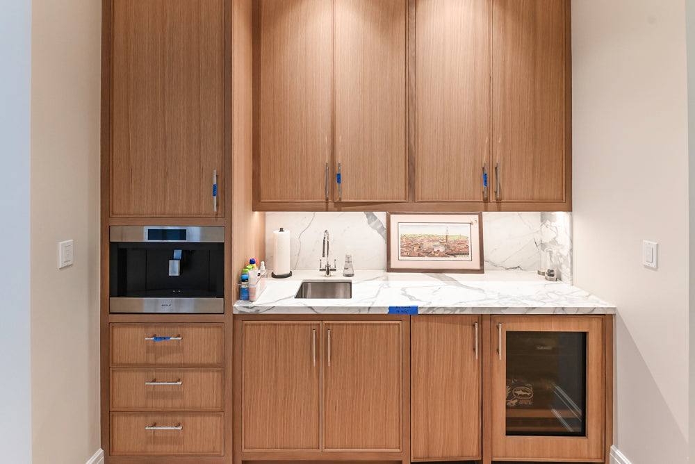 Custom Transitional Natural Wood Toned Butler's Pantry with Marble Countertops
