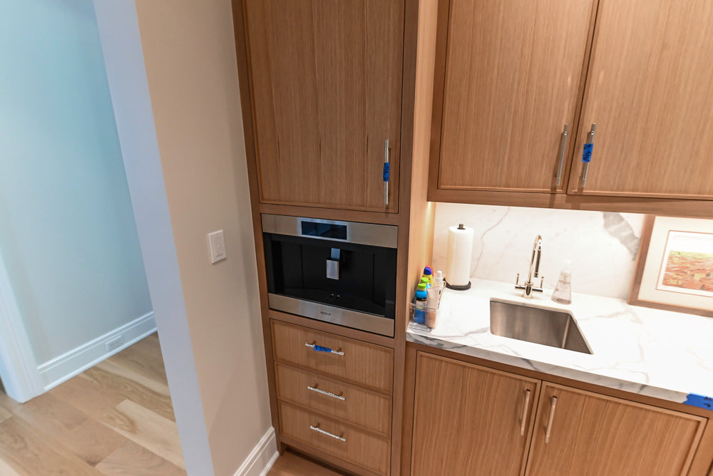 Custom Transitional Natural Wood Toned Butler's Pantry with Marble Countertops