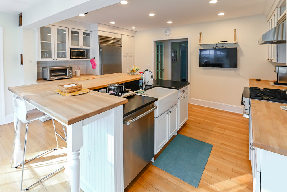 Omega Traditional White Kitchen with Island, Butcher Block Counters and Appliances
