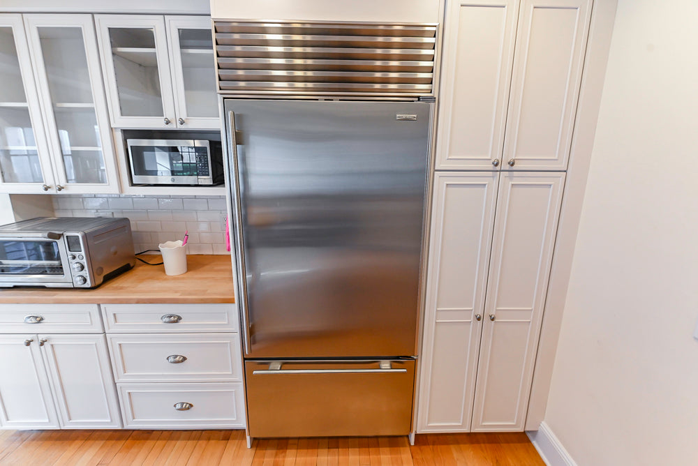 Omega Traditional White Kitchen with Island, Butcher Block Counters and Appliances