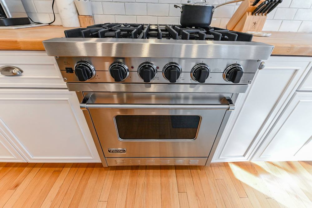 Omega Traditional White Kitchen with Island, Butcher Block Counters and Appliances