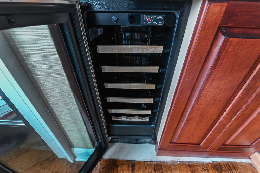 Custom Traditional Dark Wooden Kitchen with Marble Countertops and Wolf Appliances