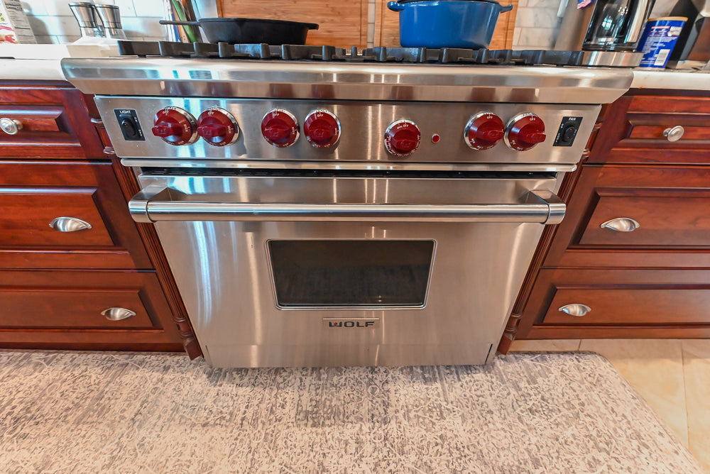 Custom Traditional Dark Wooden Kitchen with Marble Countertops and Wolf Appliances
