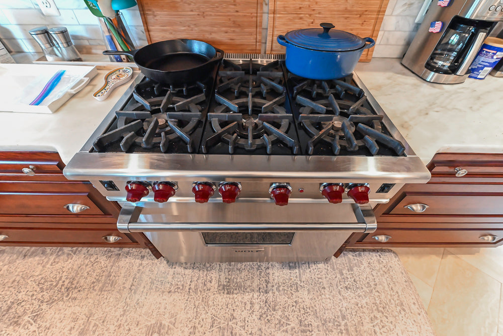 Custom Traditional Dark Wooden Kitchen with Marble Countertops and Wolf Appliances
